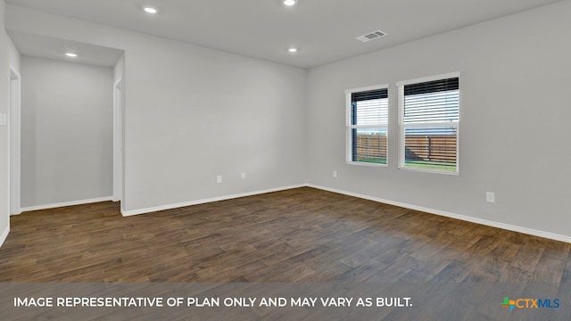 empty room featuring dark hardwood / wood-style flooring