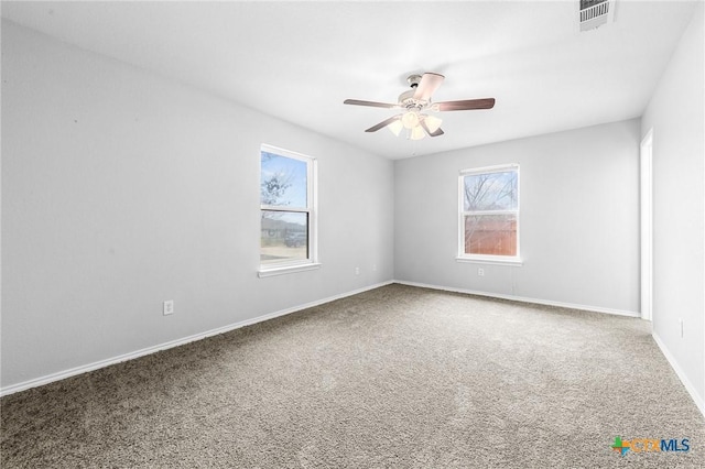 carpeted empty room with ceiling fan