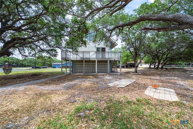 120 Retama Ln, Rockport, TX 78382 - view of yard featuring an attached garage