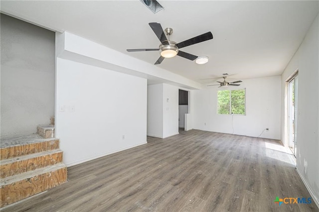 120 Retama Ln, Rockport, TX 78382 - unfurnished living room with a ceiling fan and wood finished floors