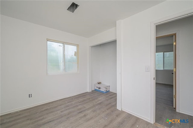 120 Retama Ln, Rockport, TX 78382 - unfurnished bedroom with wood finished floors and baseboards