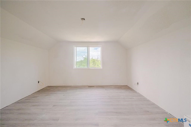 120 Retama Ln, Rockport, TX 78382 - bonus room featuring lofted ceiling and light wood finished floors
