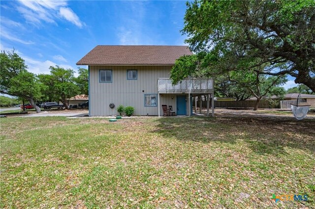 120 Retama Ln, Rockport, TX 78382 - rear view of house featuring a yard