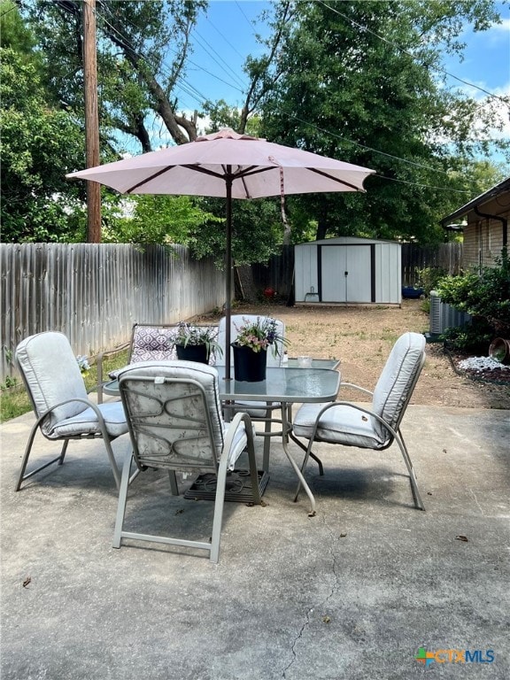 view of patio with a storage shed