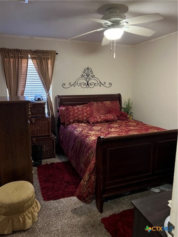 carpeted bedroom featuring ceiling fan and ornamental molding