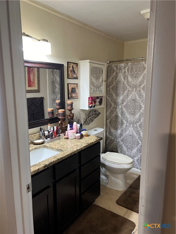 bathroom with toilet, tile patterned floors, a textured ceiling, vanity, and crown molding