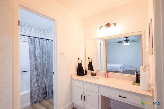 bathroom with ceiling fan, vanity, and shower / tub combo with curtain