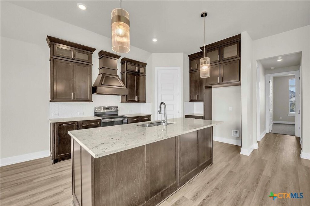 unfurnished living room featuring ceiling fan and dark hardwood / wood-style flooring