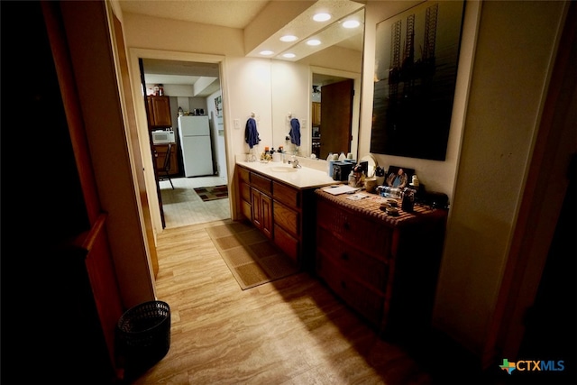 bathroom featuring vanity and hardwood / wood-style flooring