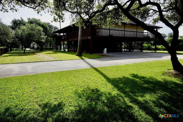 view of property's community featuring a deck and a yard