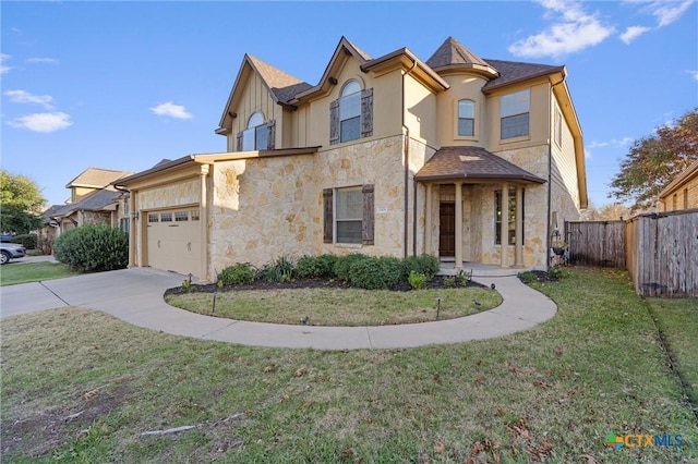 2474 Santa Barbara Loop, Round Rock, TX 78665 - view of front of home featuring stone siding, an attached garage, and driveway
