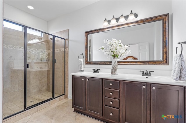 2474 Santa Barbara Loop, Round Rock, TX 78665 - full bathroom with a stall shower, double vanity, and tile patterned floors