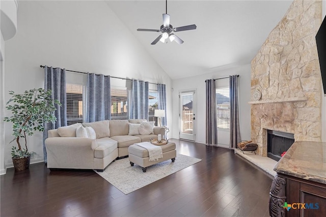 2474 Santa Barbara Loop, Round Rock, TX 78665 - living area with high vaulted ceiling, a ceiling fan, dark wood finished floors, a fireplace, and baseboards