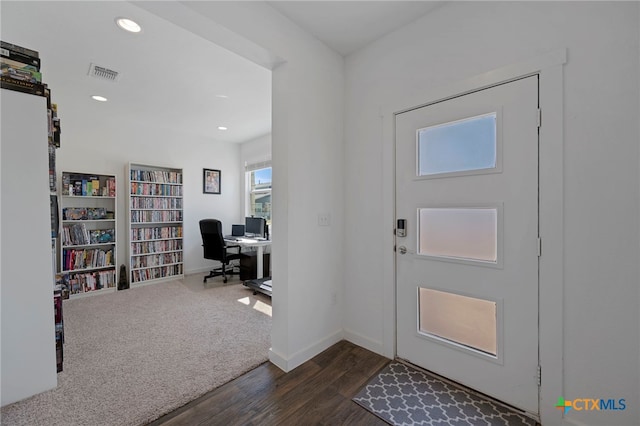 entrance foyer featuring dark wood-type flooring, recessed lighting, visible vents, and baseboards