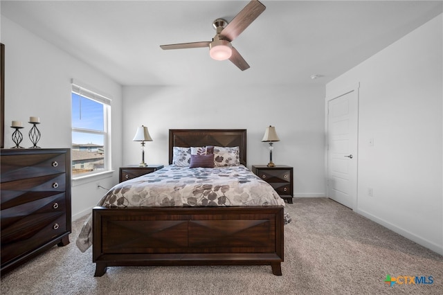 bedroom with carpet, baseboards, and a ceiling fan