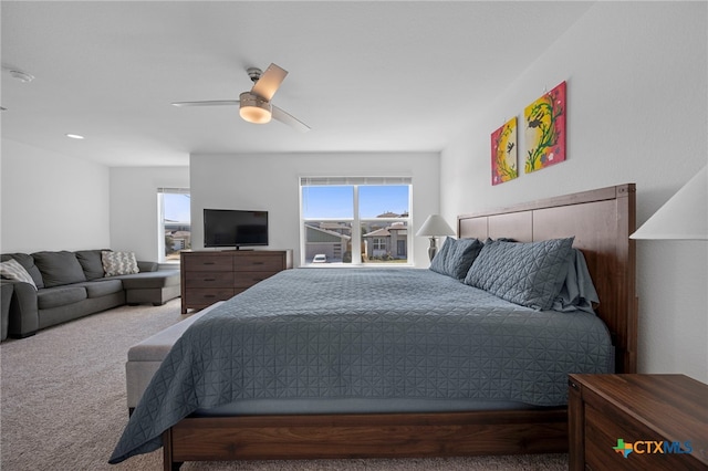 carpeted bedroom with a ceiling fan