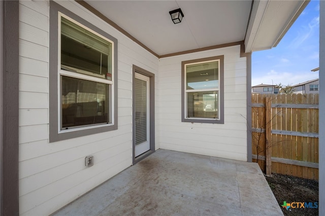 view of patio / terrace featuring fence