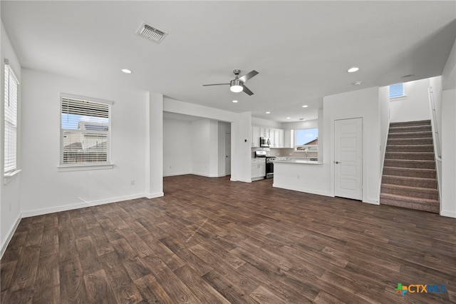 3728 Yeoman St, Pflugerville, TX 78660 - unfurnished living room featuring a ceiling fan, recessed lighting, dark wood-type flooring, visible vents, and stairway