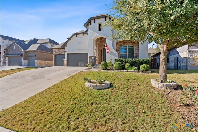 view of front of house featuring a front lawn and a garage