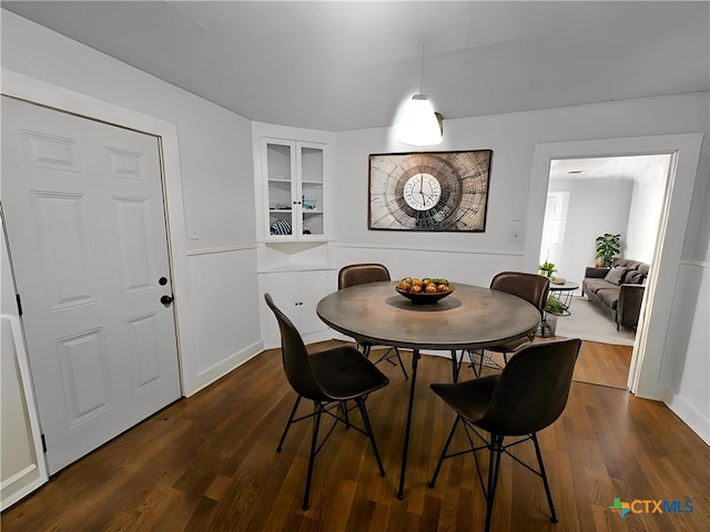 212 Duggan St, Seguin, TX 78155 - dining area featuring dark wood-style floors and built in shelves