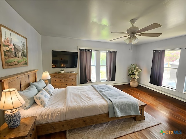 212 Duggan St, Seguin, TX 78155 - bedroom with wood finished floors and a ceiling fan