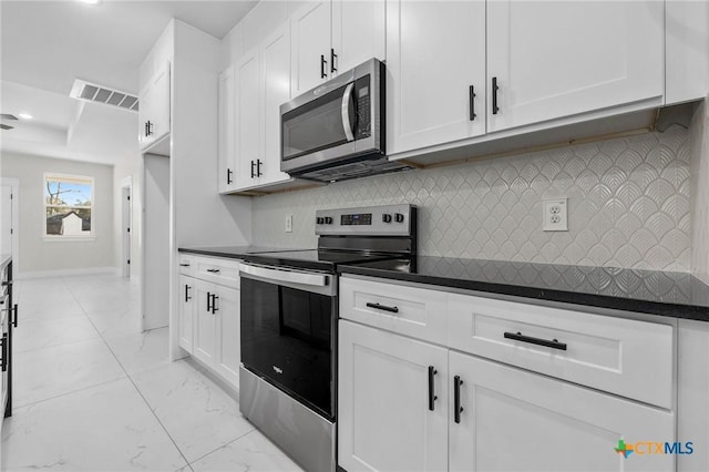 kitchen featuring appliances with stainless steel finishes and white cabinets