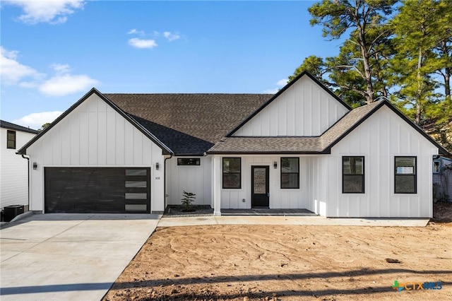 modern farmhouse with a garage and central air condition unit