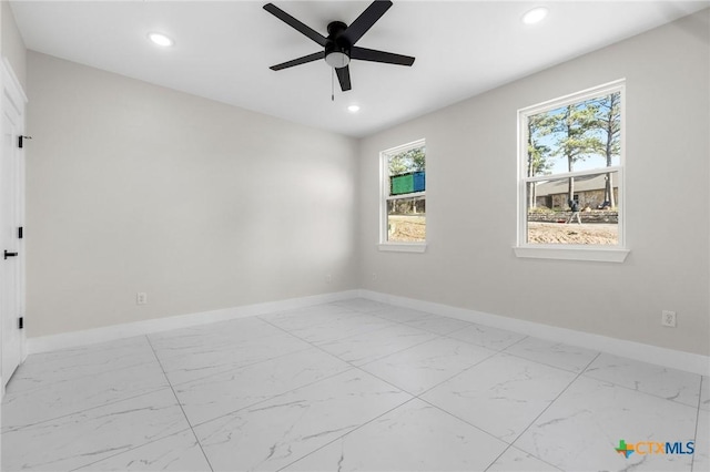 spare room featuring ceiling fan