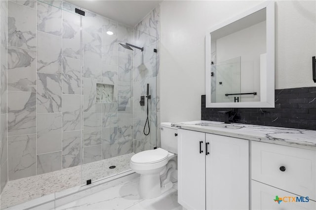 bathroom with a shower with door, vanity, tasteful backsplash, and toilet