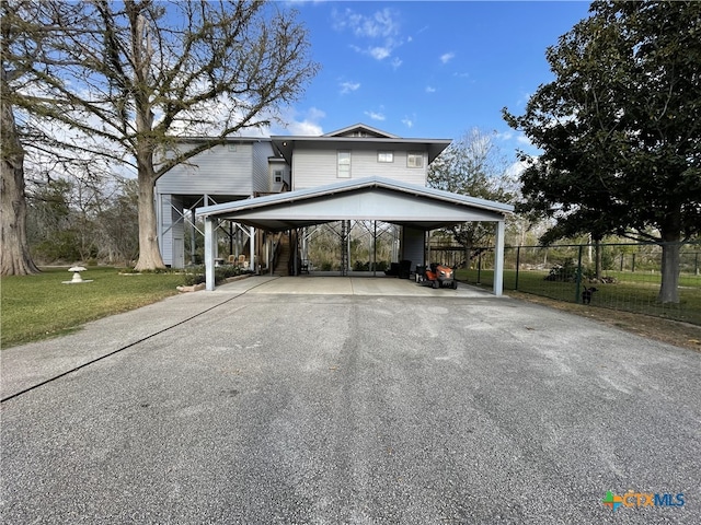 exterior space with a yard and a carport