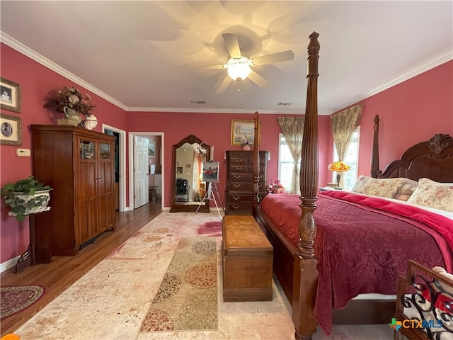 bedroom featuring ceiling fan, light hardwood / wood-style flooring, and ornamental molding