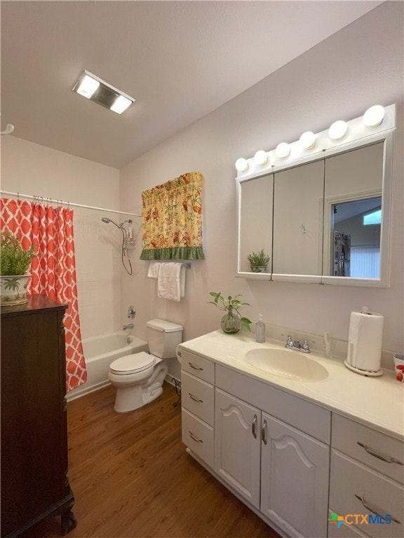 full bathroom with vanity, wood-type flooring, shower / bath combo, and toilet