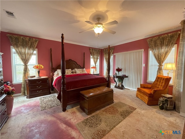 bedroom featuring ceiling fan and ornamental molding