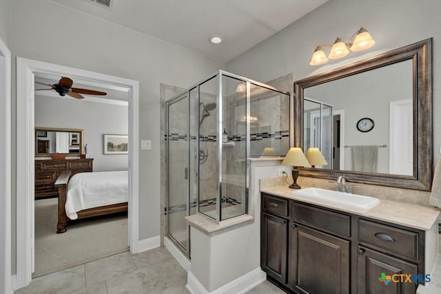 bathroom featuring ceiling fan, a shower with door, and vanity