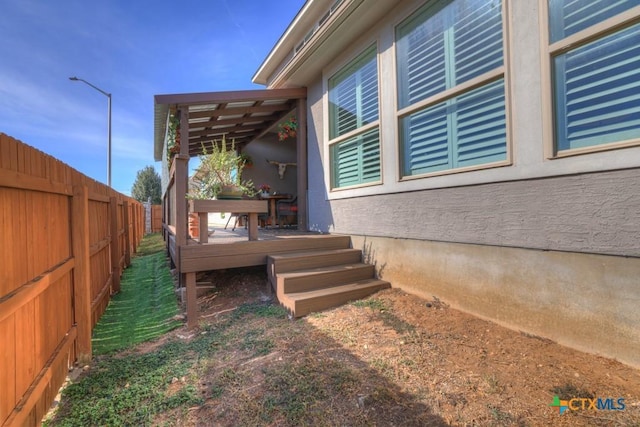 view of home's exterior featuring a deck