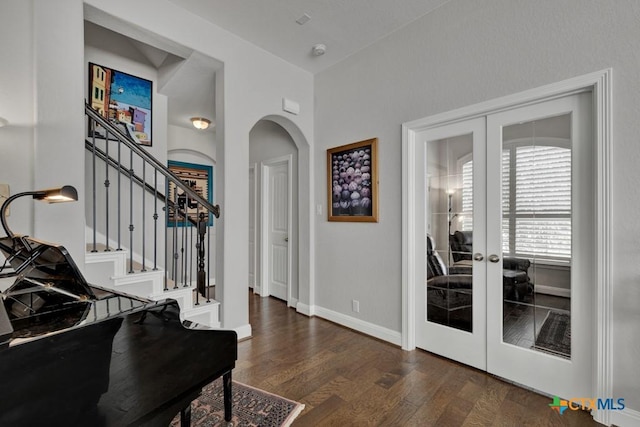 foyer featuring french doors and dark wood-type flooring