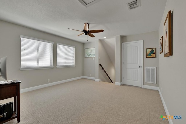 interior space with ceiling fan