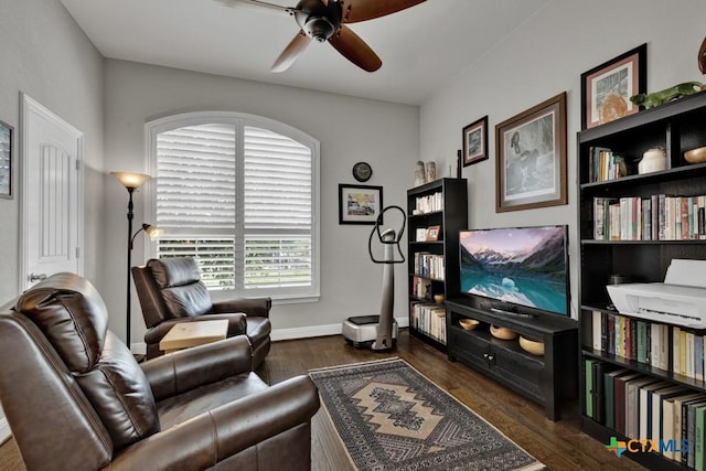 sitting room featuring ceiling fan and dark hardwood / wood-style flooring