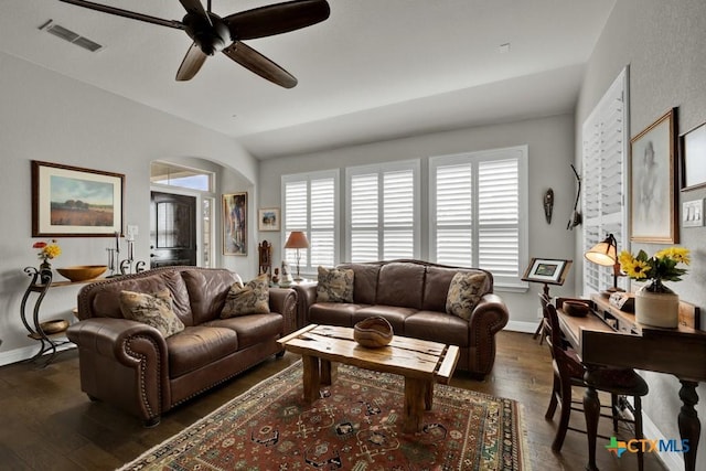 living room featuring ceiling fan, dark hardwood / wood-style flooring, and lofted ceiling