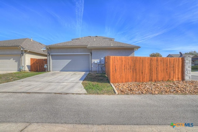 view of side of home featuring a garage