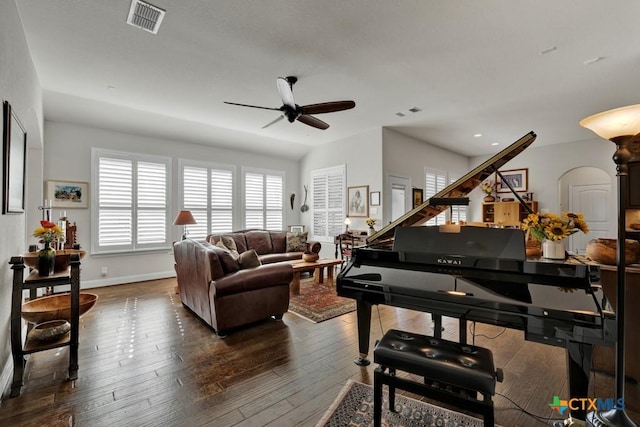 sitting room with ceiling fan and dark hardwood / wood-style flooring