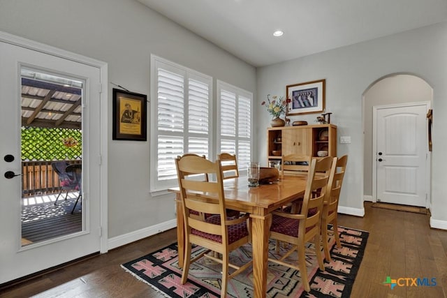 dining room with dark hardwood / wood-style flooring