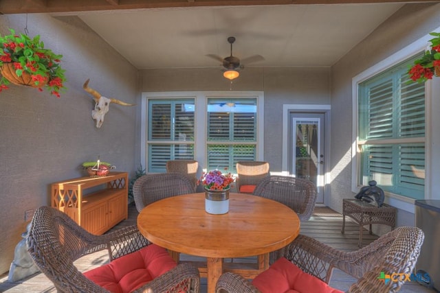 interior space with ceiling fan