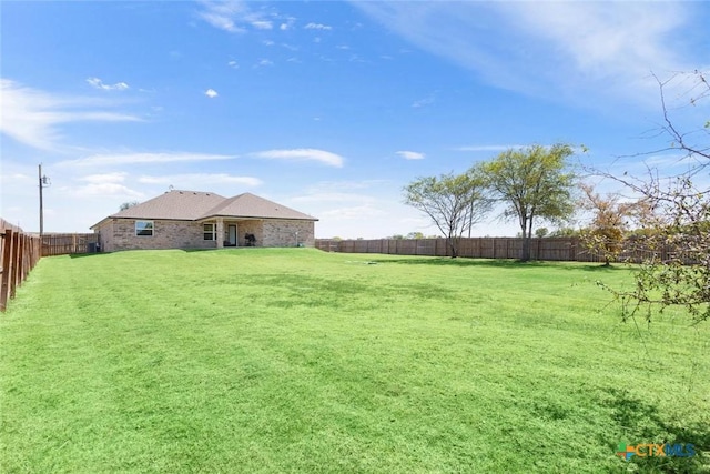 view of yard featuring a fenced backyard