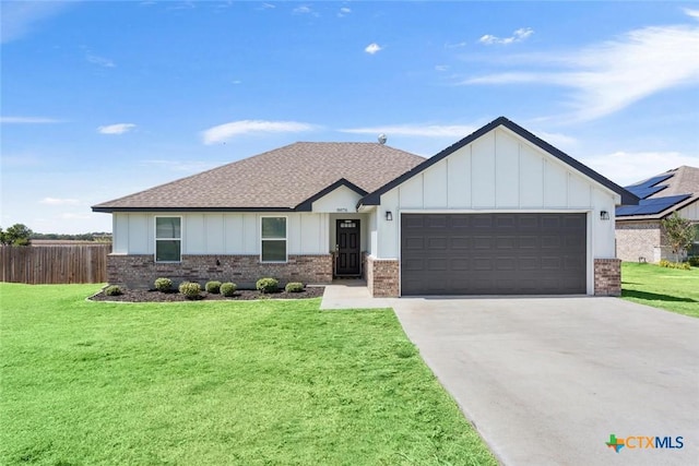 view of front facade with an attached garage, driveway, board and batten siding, and a front yard