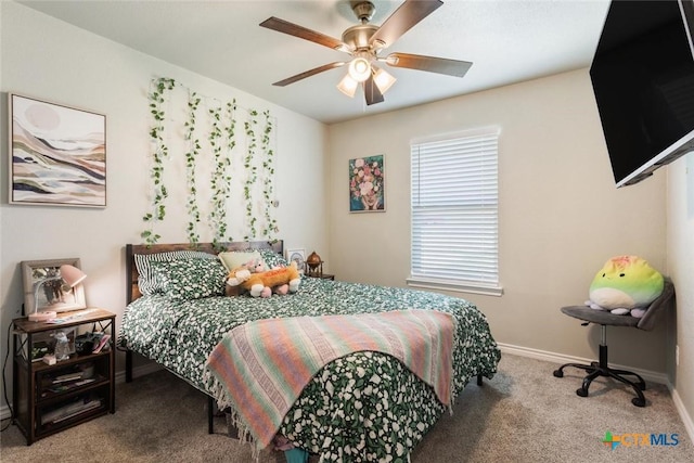 bedroom with ceiling fan, carpet floors, and baseboards