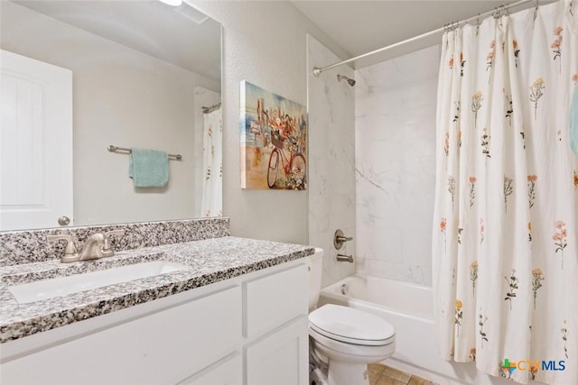 bathroom with vanity, shower / bath combo with shower curtain, and toilet