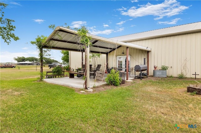 00 Dagg Rd, Yoakum, TX 77995 - exterior space with a yard, french doors, a patio, and metal roof