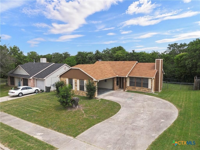 1709 Bobby Lee Dr, Killeen, TX 76549 - ranch-style home with curved driveway, stone siding, and a chimney
