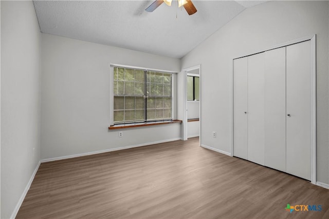 1709 Bobby Lee Dr, Killeen, TX 76549 - unfurnished bedroom featuring wood finished floors, vaulted ceiling, a closet, baseboards, and ceiling fan